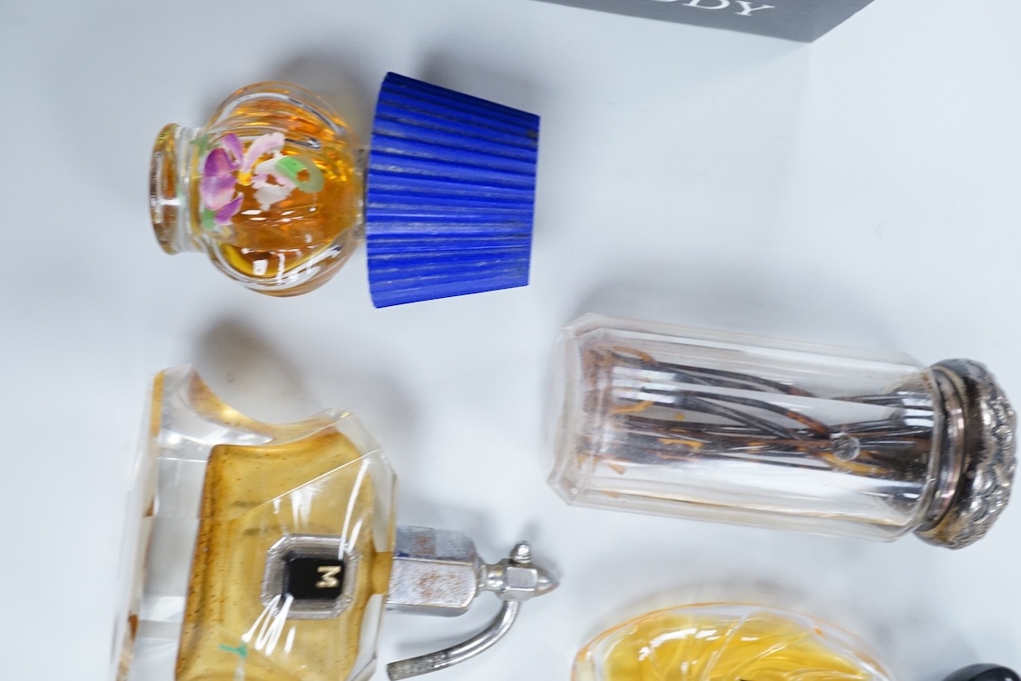 A Baccarat Guerlain perfume bottle in original box and a collection of other empty perfume bottles